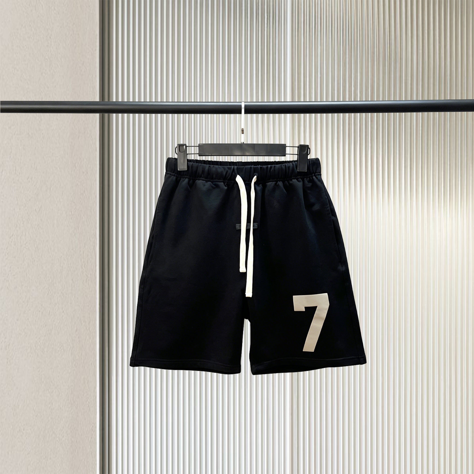 Trendy brand ESSENTIALS men's solid color looped five quarter shorts with drawstring and elastic waist, versatile street shorts
