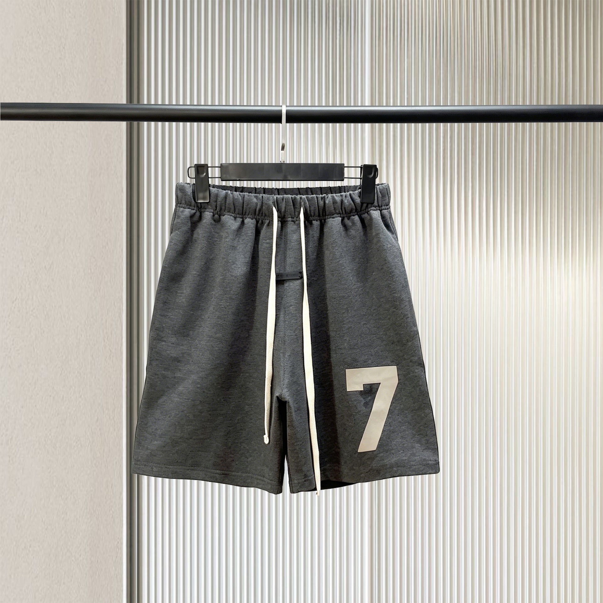 Trendy brand ESSENTIALS men's solid color looped five quarter shorts with drawstring and elastic waist, versatile street shorts