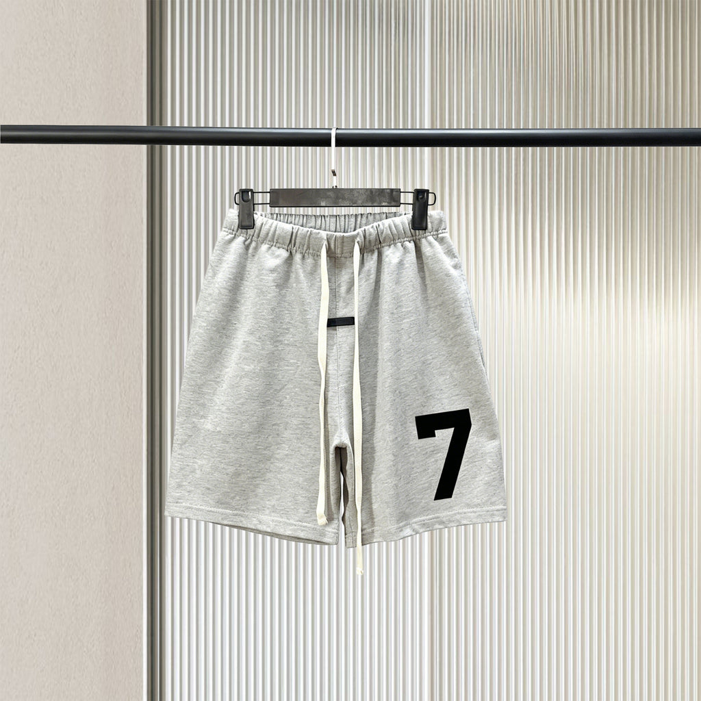 Trendy brand ESSENTIALS men's solid color looped five quarter shorts with drawstring and elastic waist, versatile street shorts