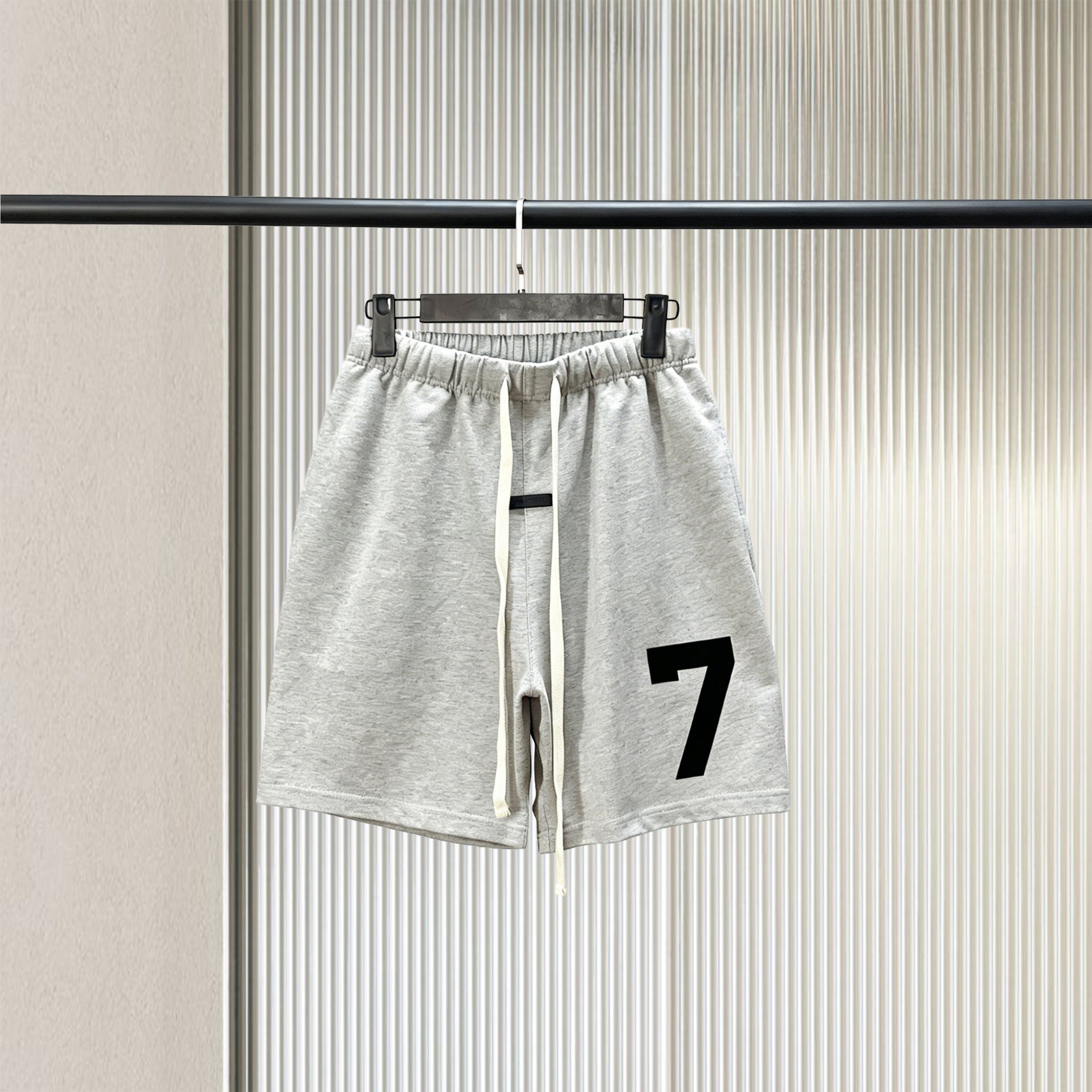 Trendy brand ESSENTIALS men's solid color looped five quarter shorts with drawstring and elastic waist, versatile street shorts