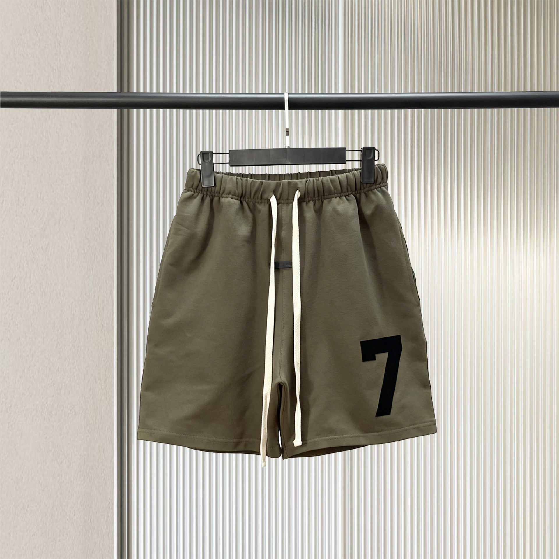 Trendy brand ESSENTIALS men's solid color looped five quarter shorts with drawstring and elastic waist, versatile street shorts